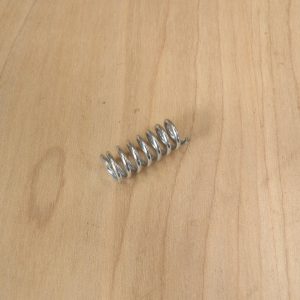 Transmission drain valve spring
